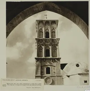 Church tower of St. Lazarus, Larnaca, seen through a large arch, with its printed caption card below.
