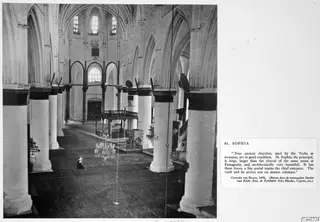Interior of St Sophia, Nicosia, looking down the nave between tall columns and pointed arches.