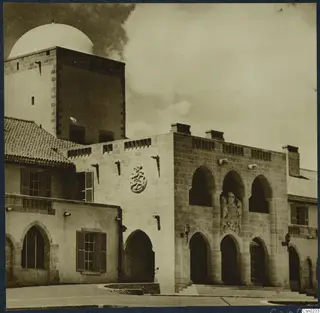 Stone building with arched openings, a carved panel and steps, Nicosia