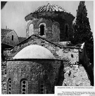 Byzantine chapel at St. Chrysostomos Monastery, with a tiled dome and a tall cypress tree beside it