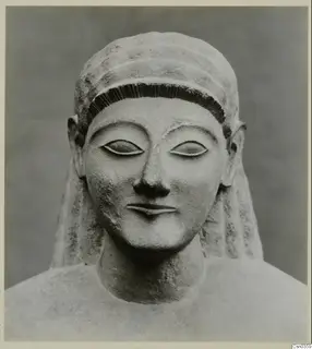 Front view of a limestone Neo-Cypriote statue head and upper torso