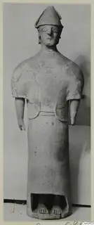 Terracotta Proto-Cypriote I: a standing figure with a tall conical cap and arms hanging at its sides