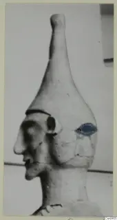 Terracotta Proto-Cypriote I: head and neck of a figure in profile facing left, with a blue patch on the side of the head.