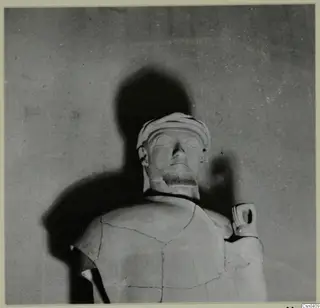 Terracotta Proto-Cypriote II, head and upper torso of a large statue with a wrapped headdress and mended cracks