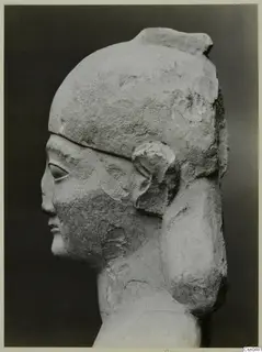 Limestone Neo-Cypriote sculpture of a head in profile, facing left, with a tall headdress