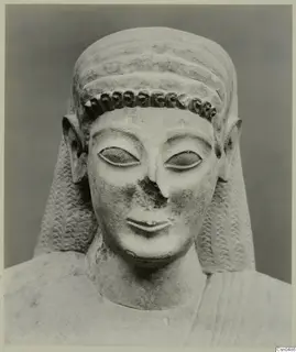 Limestone Neo-Cypriote bust with a curled band across the forehead and long side locks, nose broken