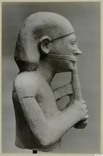 Limestone Cypro-Egyptian bust in profile, facing right, with both hands holding a long strip against its chin