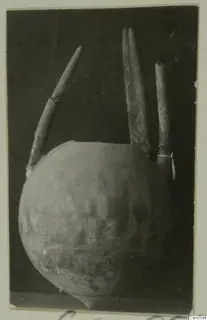 Round-bodied vessel with three tall tubular projections and an incised hatched and grid pattern on its body