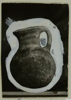 Dark jug with a single handle, outlined in white paint against a black background