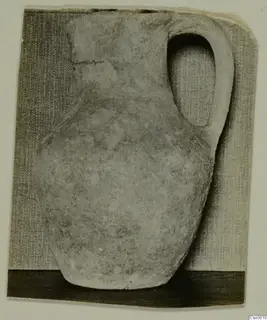 Pale pottery jug with a single loop handle and pear-shaped body, from Cyprus
