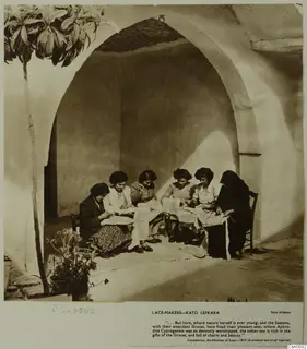 Women making lace in a whitewashed vaulted recess at Kato Lefkara