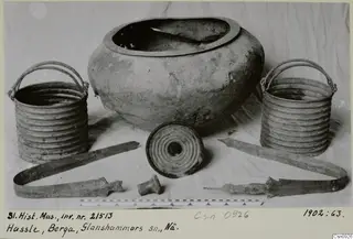 Pails and pot from Hassle, Berga, Glanshammar parish, arranged on a light cloth.
