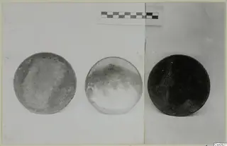 Three round, dish-like objects from Arsos, shown side by side with a scale bar above them