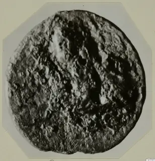 Find from Kountoura Trachonia: a round object with a heavily pitted, uneven surface