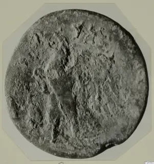 Round, worn find with faint raised markings, from Kountoura Trachonia