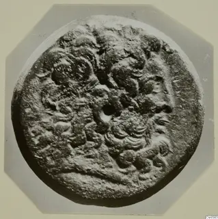 Round find with raised relief decoration, from Kountoura Trachonia.