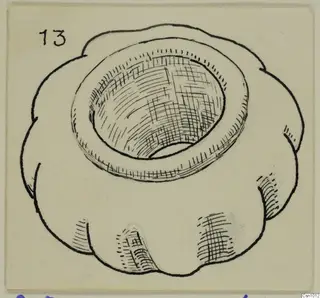 Ink drawing of a stone macehead with a lobed outer edge and a deep central hole.