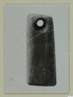 Flat rectangular pendant with a round hole near its upper end, from Lapithos.