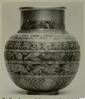 Globular pot with a flared rim, decorated with bands of relief animals and rosettes