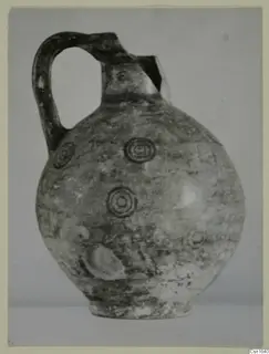 Round-bodied jug with a strap handle and concentric circle motifs, from Marion, Tomb 12