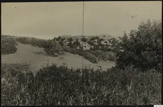 Rocky hill and sandy slope covered with scrub at Nitovikla, Karpas Peninsula