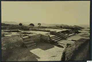 Stone staircase and walls among the ruins at Vouni palace, with hills and sea beyond