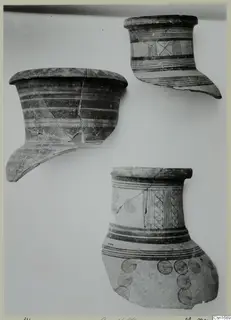 Three fragments of painted pottery vessels from Marion, with bands and concentric circle motifs