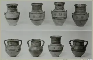 Eight painted pots from Marion arranged in two rows, four tall-necked vessels above and four two-handled jars below.