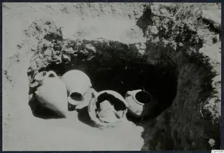 Tomb 94 at Marion during excavation, with pottery vessels lying in situ in the cut opening