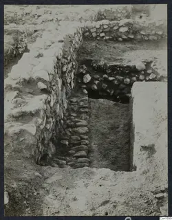 Excavated stone walls and a cobbled passage at the Cholades Temples A-B at Soli.