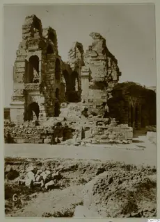 Ruined stone and brick building with arched openings and broken walls, North Africa