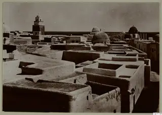 Flat roofs of a town with domes and a tall tower, North Africa