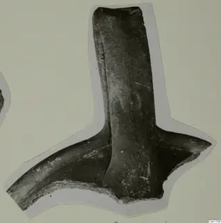 Pottery sherd with a thick vertical handle joining a curved body fragment, photographed on a cut-out card mount
