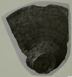 Roman Wares I-III: a pottery sherd with a rounded foot, mounted on grey card.
