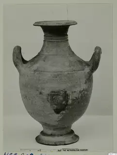 Hellenistic Wares: two-handled pottery jar with a flared rim, ribbed neck and ring base, shown upright against a plain backdrop.