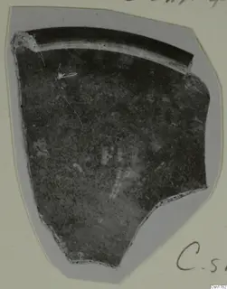 Pottery sherd with a curved rim, photographed on a grey card mount