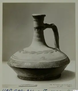 Cypro-Hell. II pottery jug with a single handle and a painted leaf band around the shoulder