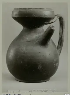 Cypro-Hell. II jar with a side spout and strap handle, seen from the side