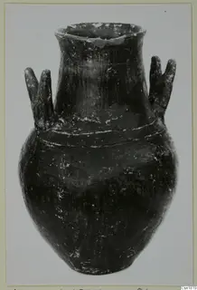 Red Polished I jar with a flaring neck, two pairs of lug handles and two raised bands around the shoulder.