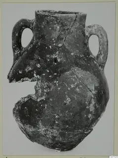 Red Polished I pottery vessel from Vounous, with two loop handles and a broken lower body