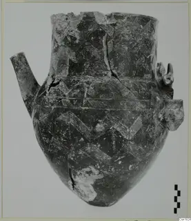 Pottery jar, Red Polished I, with incised chevron pattern and a side spout