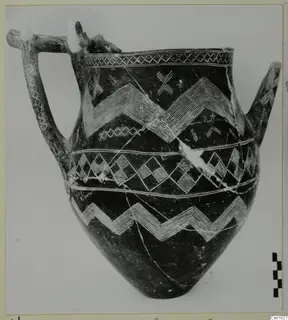 Dark polished vessel with white-painted zigzag and lattice bands, from Vounous
