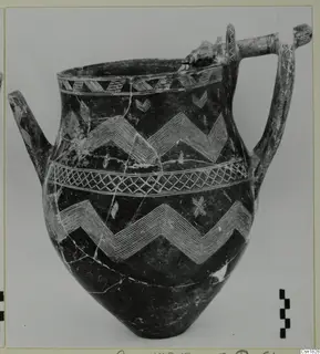 Red Polished I jar with a spout, two handles and pale zigzag and lattice bands