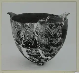 Red Polished I bowl from Vounous, with two small lugs at the rim and incised zigzag bands on the body