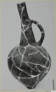 Red Polished I jug from Vounous with a single handle and incised patterns