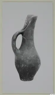 Pottery jug with a single loop handle and pinched spout, Red Polished I (Vounous 120.25), shown upright