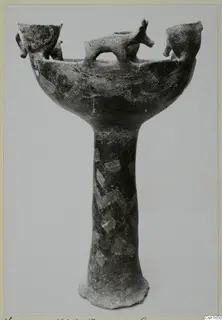 Red Polished I footed vessel from Vounous, with small animal heads on the rim and incised chevron patterns