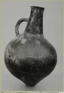Pottery Red Polished I jug from Vounous with a loop handle and incised zigzag decoration on the neck