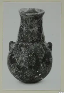 Pottery vessel from Vounous with a flared neck and incised chevron and lozenge decoration