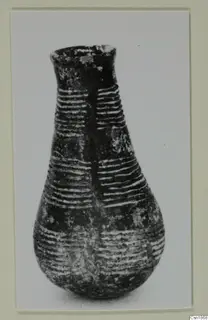 Pottery Red Polished I vessel from Vounous with a narrow neck and banded lines
